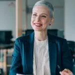 a person dressed in professional attire, having a meeting