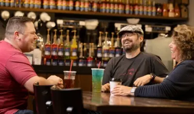 three people at bar