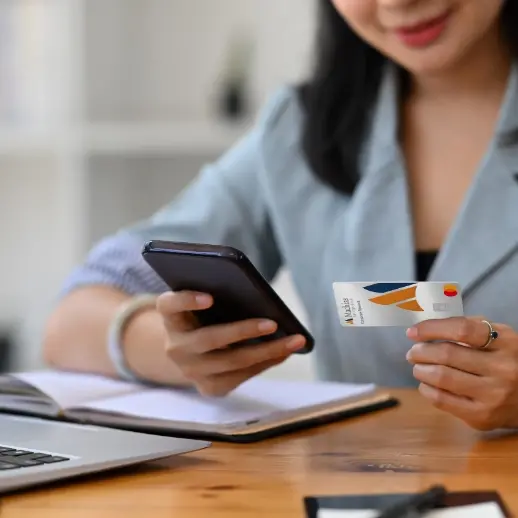 Woman on phone with card