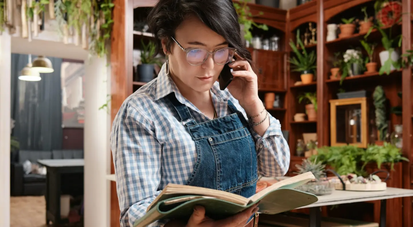 woman business owner with book