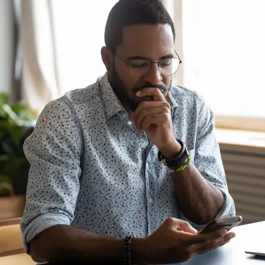 man looking at phone