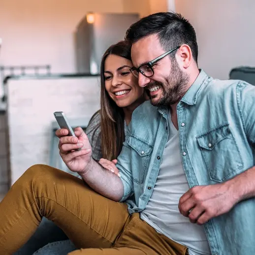 Couple looking at mobile phone