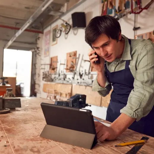 workshop employee on phone