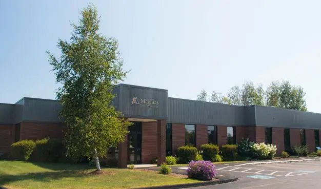 a brown and black Machias Bank building located in Bangor