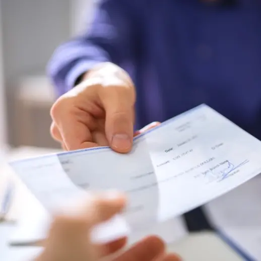 Man handing out a check