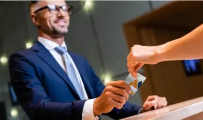 hotel concierge handing out room key