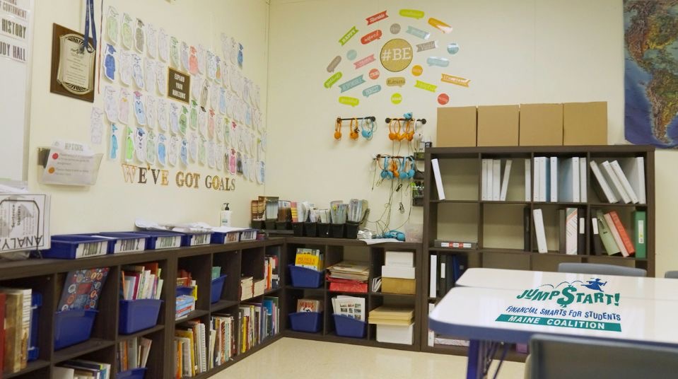 a classroom with positive decorations and many books