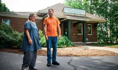 Man and woman standing outside building