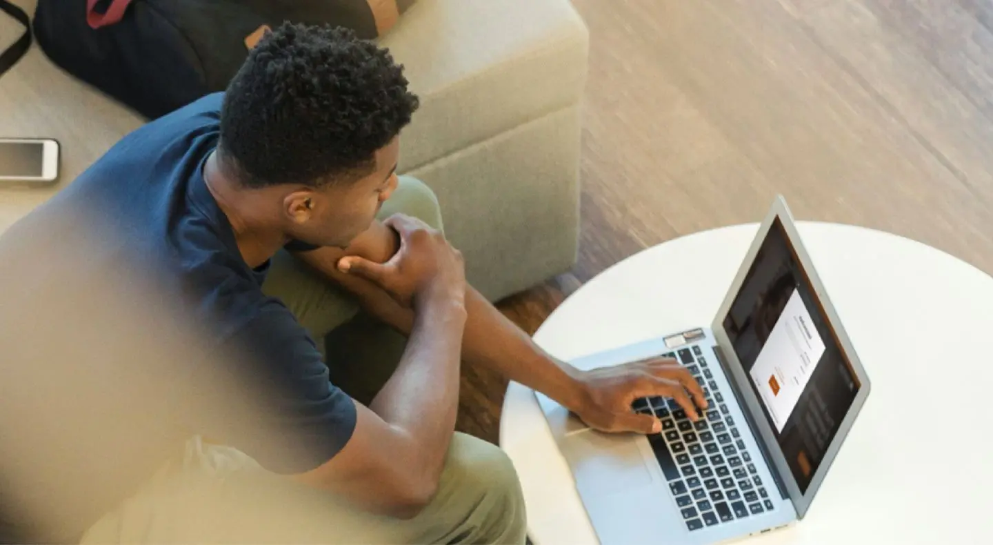 a person typing on a laptop